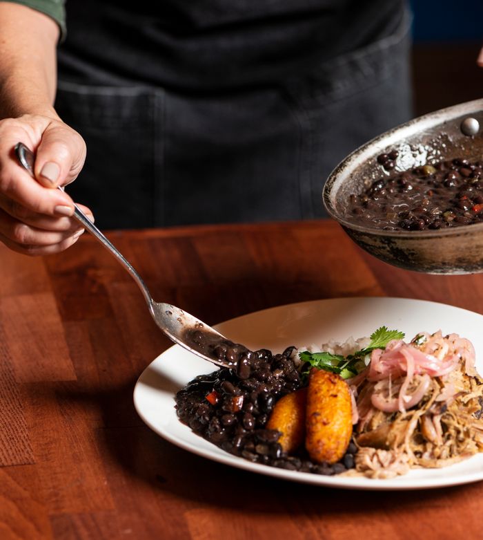 services-01 Delicious traditional Cuban dish with black beans and plantains. Perfect for a healthy and savory breakfast or meal.